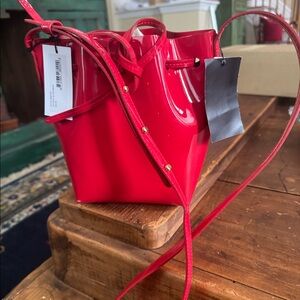 Mansur Graviel red bucket bag with tags